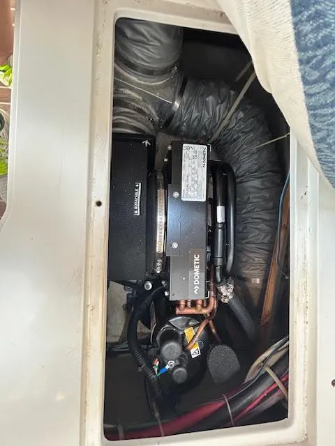 Slide: The Image of Engine compartment of a 1995 Lagoon TPI 37 boat, showcasing mechanical components. - 41