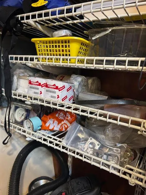 Slide: The Image of Storage shelves with assorted boat supplies and tools for a 1995 Lagoon TPI 37. - 42