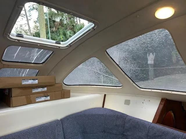 Slide: The Image of Interior of a 1995 Lagoon TPI 37 yacht with windows and seating area. - 49