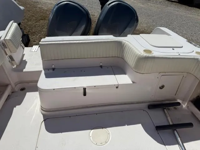 Slide: The Image of 2003 Grady-White Sailfish 282 boat interior with seating and storage compartments. - 13