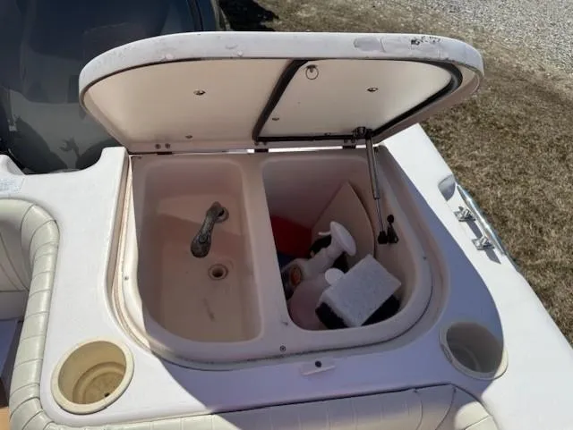 Slide: The Image of Open storage compartment on 2003 Grady-White Sailfish 282 boat, showing interior contents. - 14