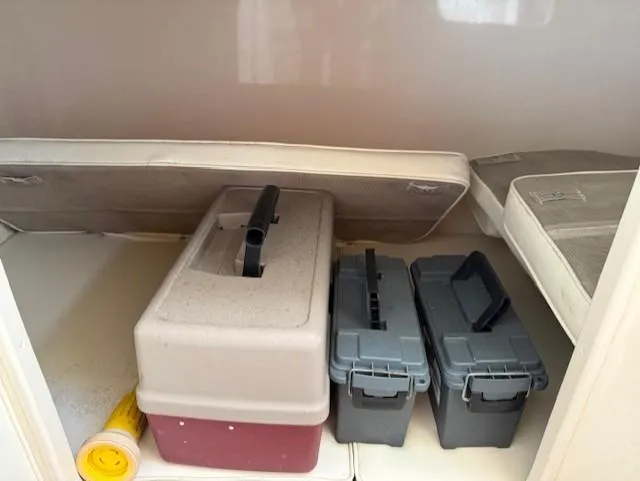 Slide: The Image of Storage compartment in a 2003 Grady-White Sailfish 282 with cooler and storage boxes. - 17