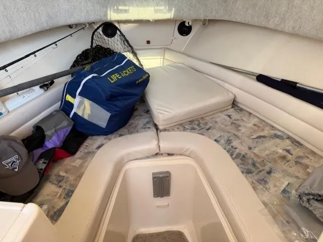 Slide: The Image of 2003 Grady-White Sailfish 282 cabin interior with life jackets and fishing gear. - 20