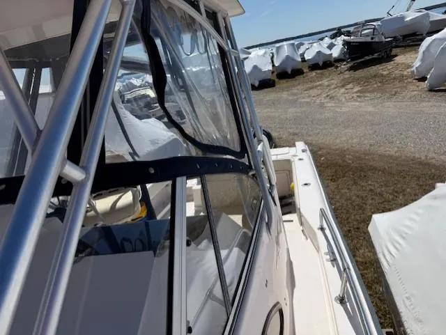 Slide: The Image of 2003 Grady-White Sailfish 282 boat docked, featuring sleek design and clear windows. - 5