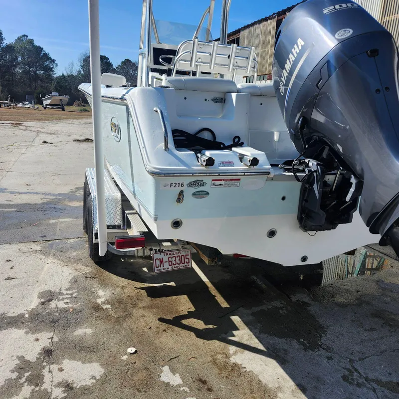 Slide: The Image of 2016 Sea Hunt Ultra 225 boat with Yamaha engine on trailer. - 1