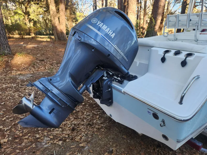 Slide: The Image of 2016 Sea Hunt Ultra 225 with Yamaha outboard motor in wooded area. - 5