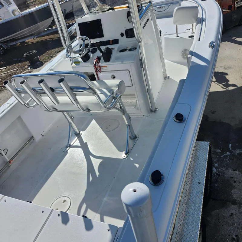 Slide: The Image of 2016 Sea Hunt Ultra 225 boat interior with steering console and seating. - 7