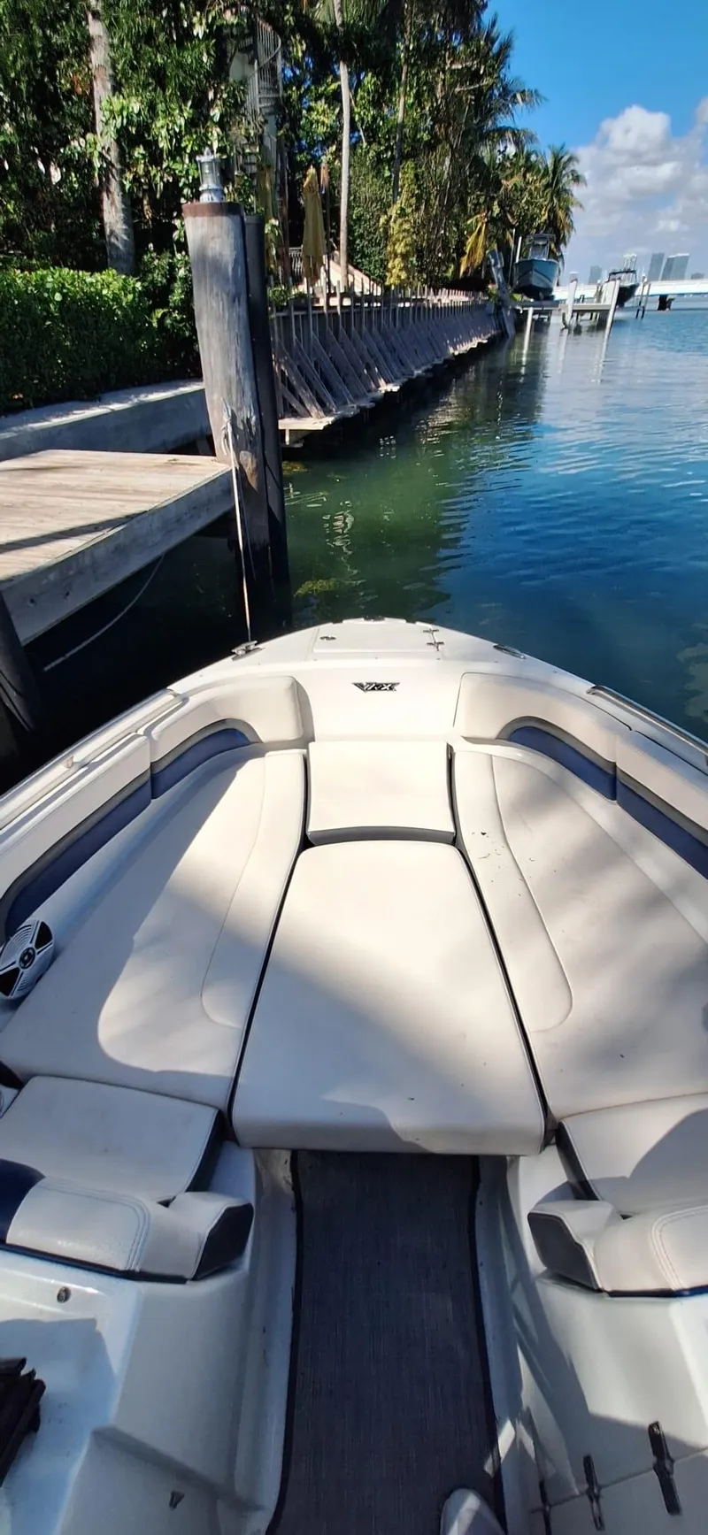 Slide: The Image of 2018 Chaparral Vortex 243 VRX boat docked by a scenic waterfront. - 12