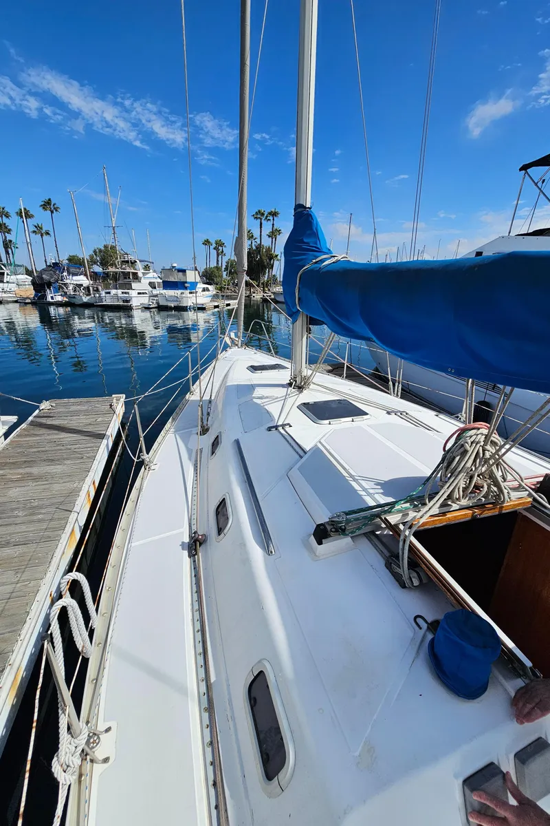 Slide: The Image of 1988 Hunter Legend 35 sailboat docked in marina. - 17