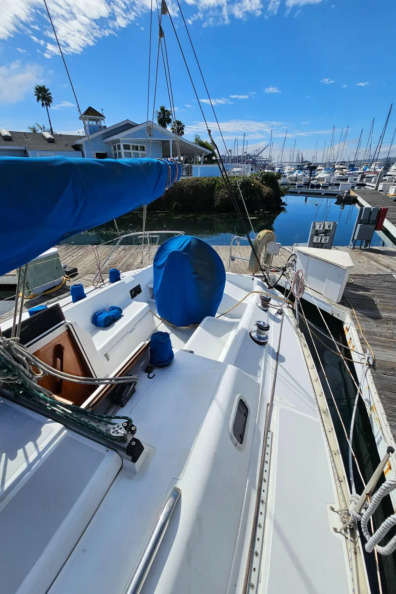 Slide: The Image of 1988 Hunter Legend 35 sailboat docked, blue sky. - 18
