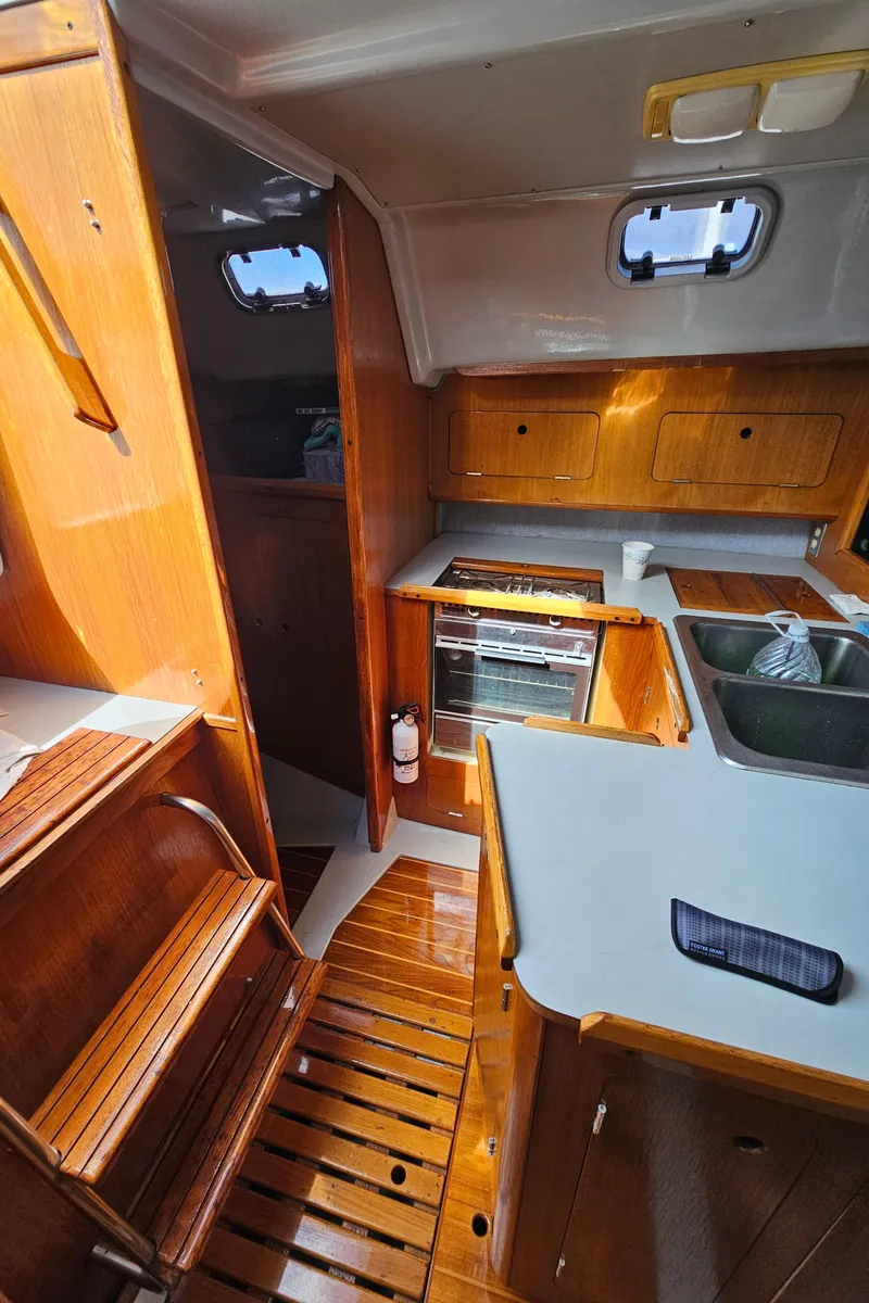 Slide: The Image of Interior of a 1988 Hunter Legend 35 yacht with wooden finish. - 27