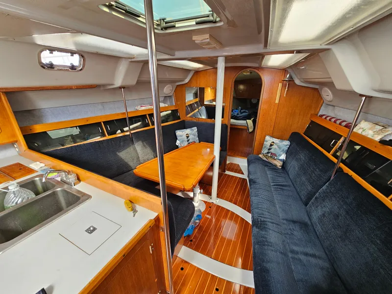 Slide: The Image of Interior of a 1988 Hunter Legend 35 yacht with wooden furnishings. - 29