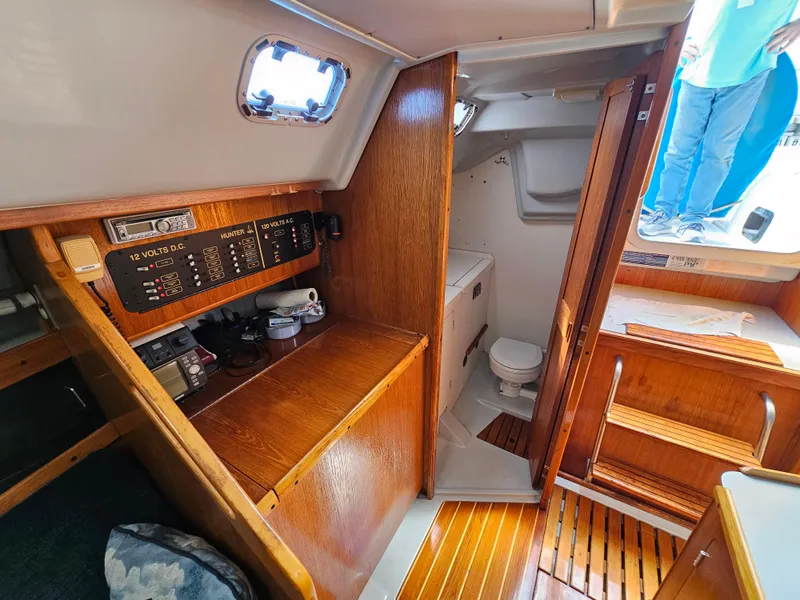 Slide: The Image of Interior of a 1988 Hunter Legend 35 yacht with wooden furnishings. - 30