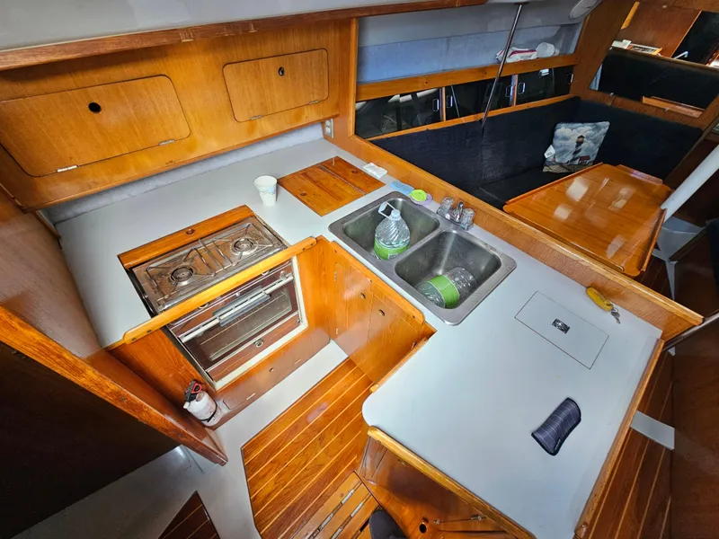 Slide: The Image of Interior of 1988 Hunter Legend 35 yacht with kitchen and sink. - 31