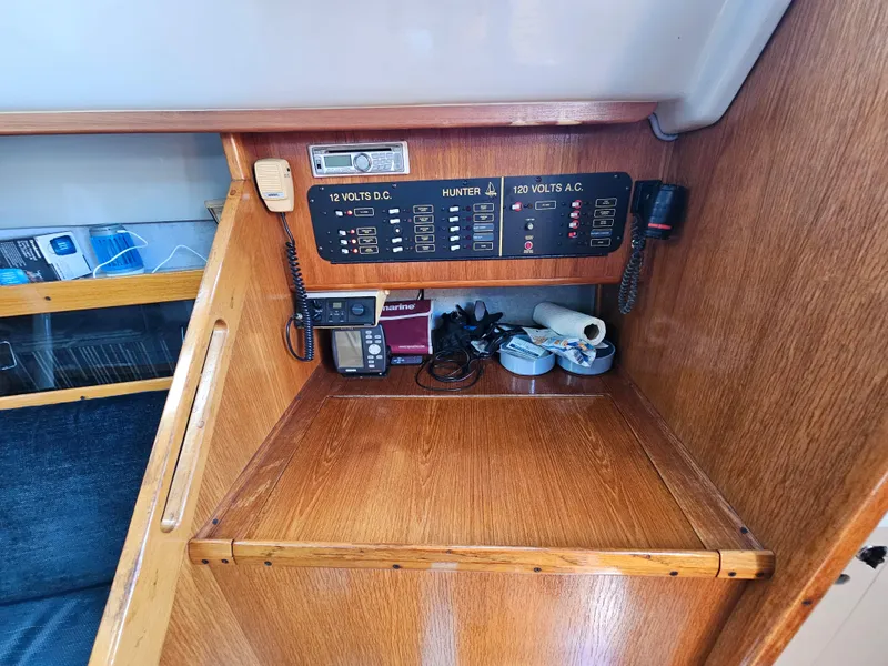 Slide: The Image of Interior view of a 1988 Hunter Legend 35 sailboat with control panel. - 37