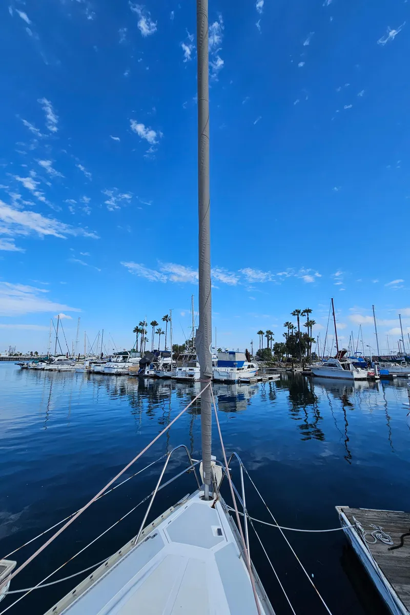 Slide: The Image of Sailboat Hunter Legend 35 in harbor, blue sky, calm water. - 4