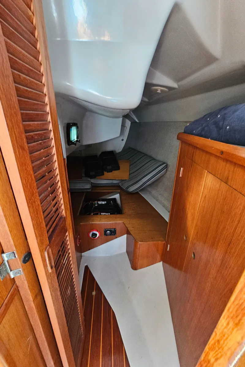 Slide: The Image of Interior of a 1988 Hunter Legend 35 yacht with wooden furnishings. - 43