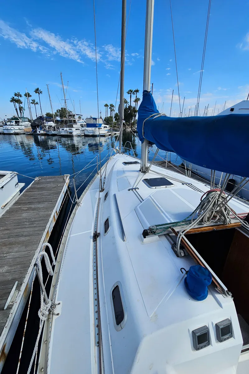Slide: The Image of 1988 Hunter Legend 35 sailboat docked in marina. - 7
