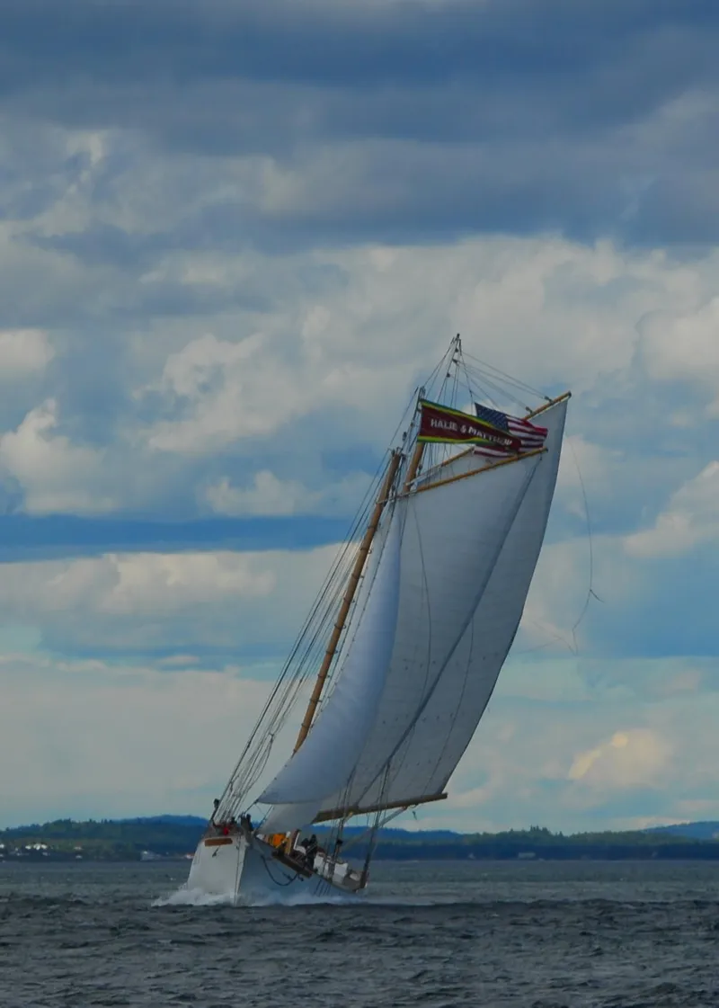 Slide: The Image of Schooner HARRIS and BISHOP sailing on open water under cloudy skies, 2006. - 1