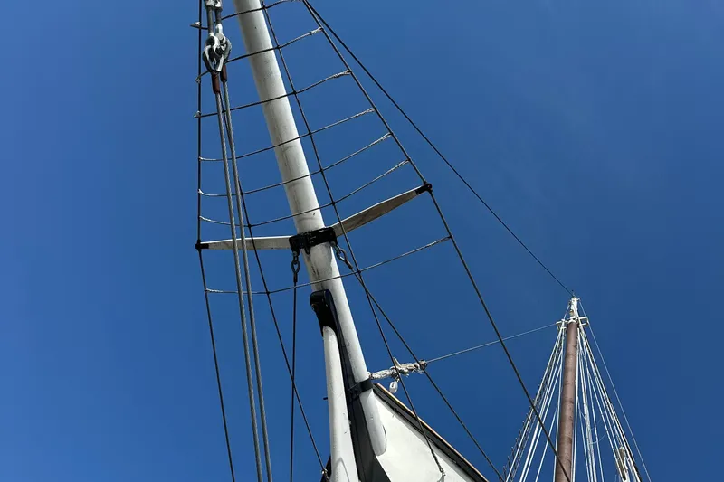 Slide: The Image of Tall mast of 2006 Schooner HARRIS and BISHOP against clear blue sky. - 10