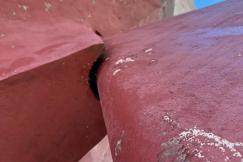 Slide: The Image of Close-up of red-painted schooner hull detail, Schooner HARRIS and BISHOP, 2006 model. - 14