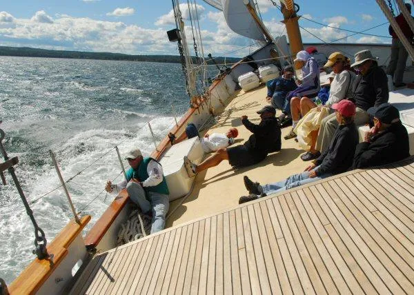 Slide: The Image of People relaxing on a 2006 Schooner HARRIS and BISHOP sailing on a sunny day. - 19