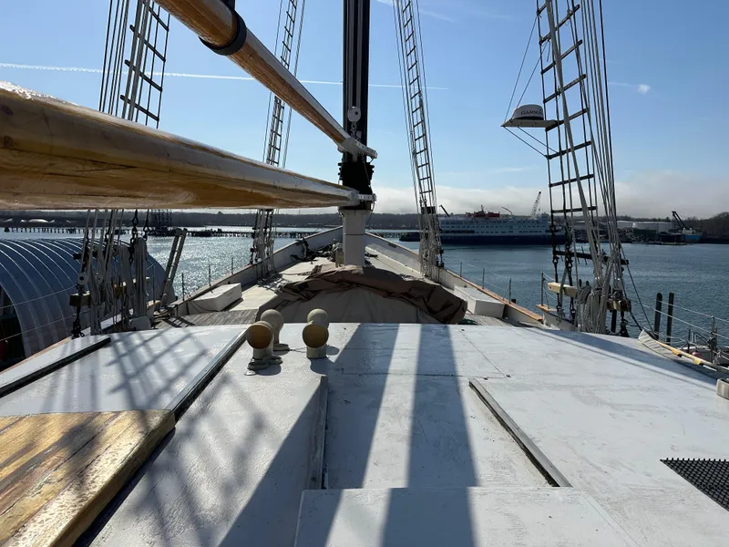 Slide: The Image of Schooner HARRIS and BISHOP 2006 on calm waters, showcasing deck and rigging. - 27