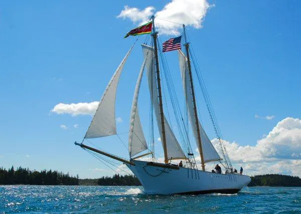 Slide: The Image of Schooner HARRIS and BISHOP 2006 sailing with flags on a sunny day. - 3
