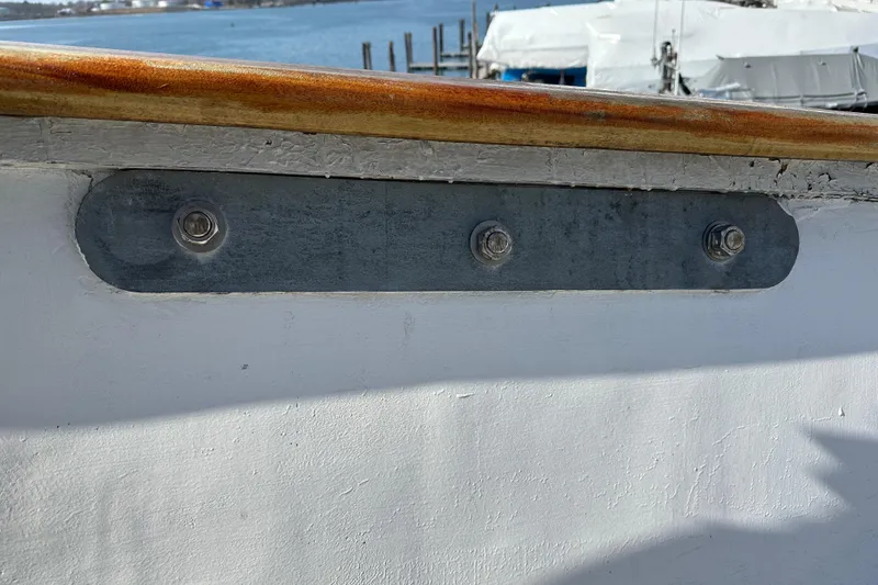 Slide: The Image of Close-up of a 2006 Schooner HARRIS and BISHOP boat railing with metal fittings. - 30