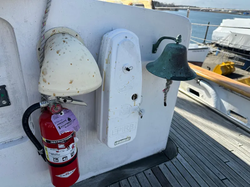 Slide: The Image of Fire extinguisher, bell, and equipment on 2006 Schooner HARRIS and BISHOP deck. - 37