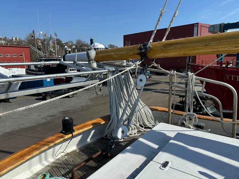 Slide: The Image of Schooner HARRIS and BISHOP 2006 deck with rigging and ropes in a shipyard setting. - 40