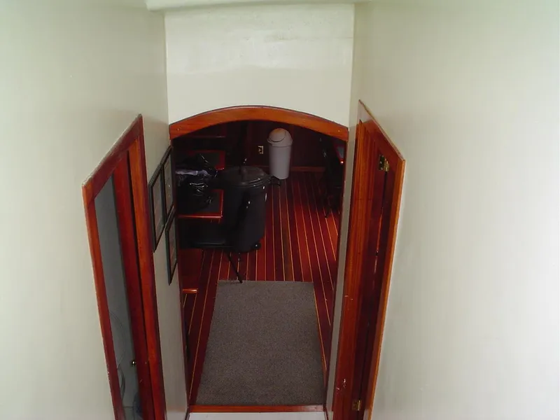 Slide: The Image of Interior view of 2006 Schooner HARRIS and BISHOP with wooden doors and striped flooring. - 42