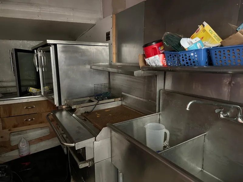 Slide: The Image of Commercial kitchen with stainless steel appliances and storage, aboard a 2006 Schooner HARRIS and BISHOP. - 49