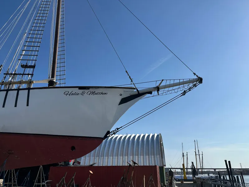 Slide: The Image of Schooner HARRIS and BISHOP 2006 docked, blue sky background, maritime setting. - 8
