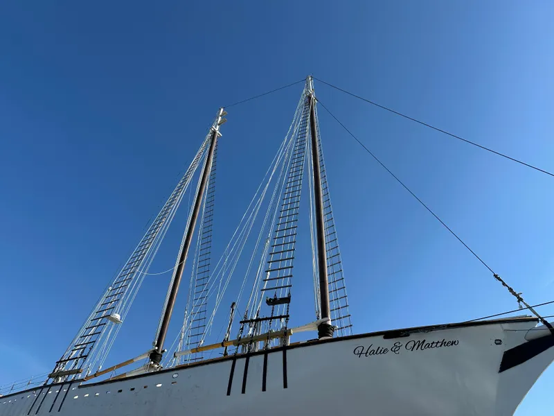Slide: The Image of Schooner HARRIS and BISHOP 2006 with tall masts against a clear blue sky. - 9
