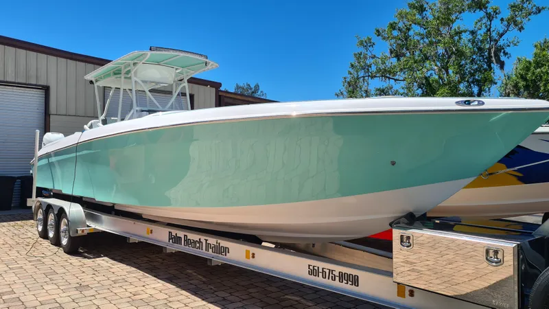 The Image of 2025 Custom Core 38 Center Console boat on trailer, parked outdoors. - 0