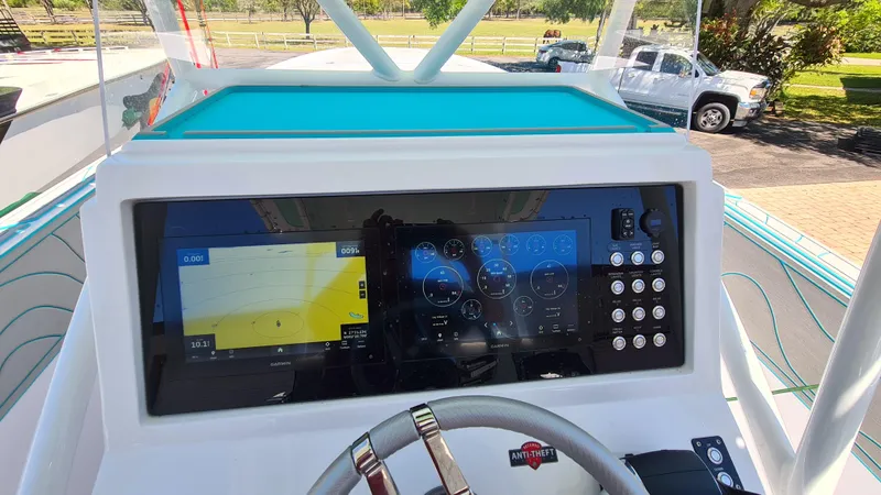 Slide: The Image of 2025 Custom Core 38 Center Console dashboard with advanced navigation and control systems. - 16