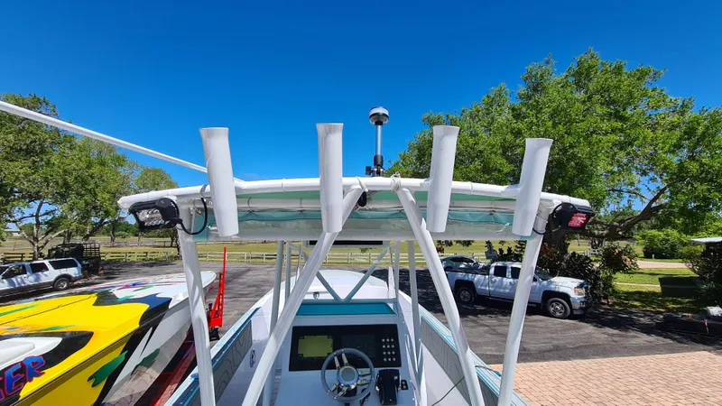 Slide: The Image of 2025 Custom Core 38 Center Console boat with advanced navigation system and rod holders. - 23