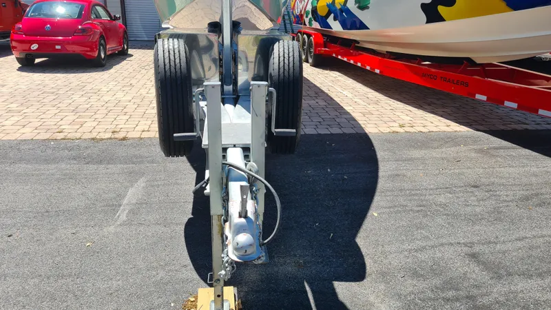 Slide: The Image of 2025 Custom Core 38 Center Console boat on trailer, parked on paved surface. - 34