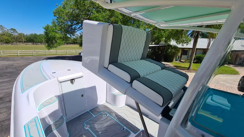 Slide: The Image of 2025 Custom Core 38 Center Console boat with stylish seating and modern design. - 8