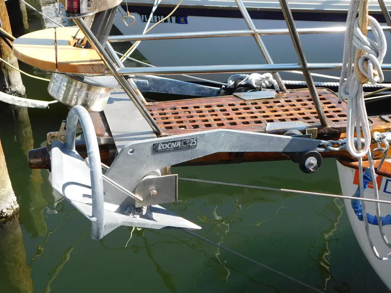 Slide: The Image of Anchor on 1984 Tayana 37 sailboat, featuring Rocna 25 model, docked at marina. - 14