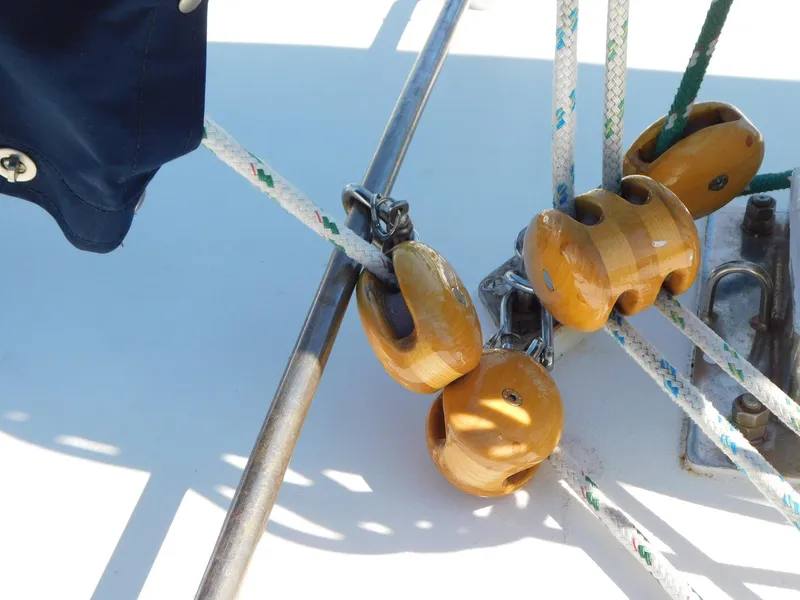 Slide: The Image of Rope and wooden blocks on 1984 Tayana 37 sailboat deck. - 15