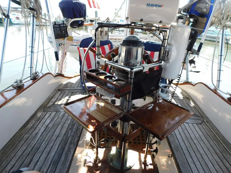 Slide: The Image of Cockpit of 1984 Tayana 37 sailboat with wooden flooring and navigation equipment. - 21