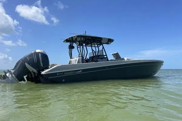 The Image of 1996 Formula 382 SR1 boat on calm water under clear blue sky. - 0