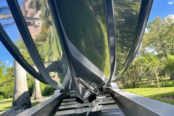 Slide: The Image of 1996 Formula 382 SR1 boat hull on trailer, reflecting greenery and blue sky. - 10