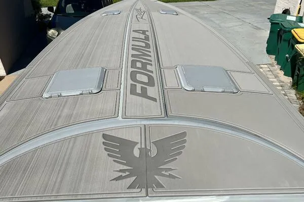 Slide: The Image of 1996 Formula 382 SR1 boat deck with logo and emblem, viewed from above. - 15