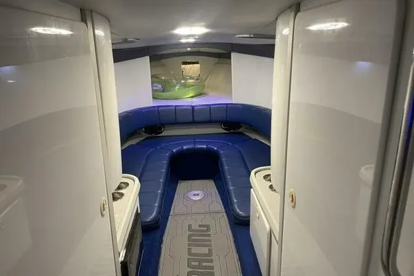 Slide: The Image of 1996 Formula 382 SR1 boat interior with blue seating and modern design. - 16