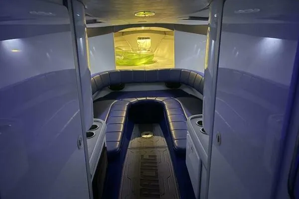 Slide: The Image of Interior of a 1996 Formula 382 SR1 boat with blue seating and ambient lighting. - 17