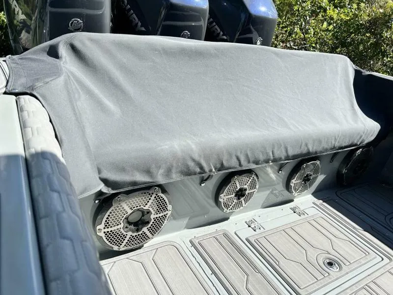 Slide: The Image of 1996 Formula 382 SR1 boat with covered seating and visible speakers on deck. - 27