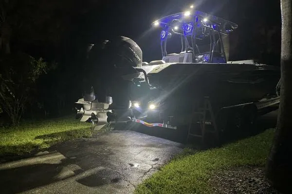 Slide: The Image of 1996 Formula 382 SR1 boat illuminated at night, showcasing powerful engines and sleek design. - 32